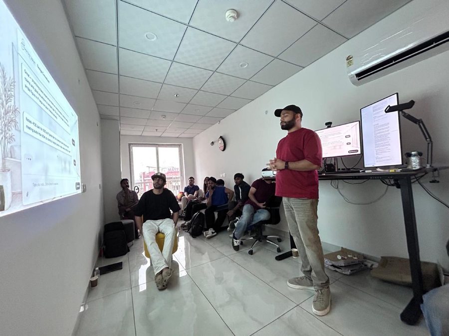 A member presenting to the room at the Coffee with Claude Entrepreneur Edition session.
